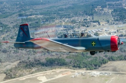 An airborne shot of a single-engine airplane called a Nanchang CJ6